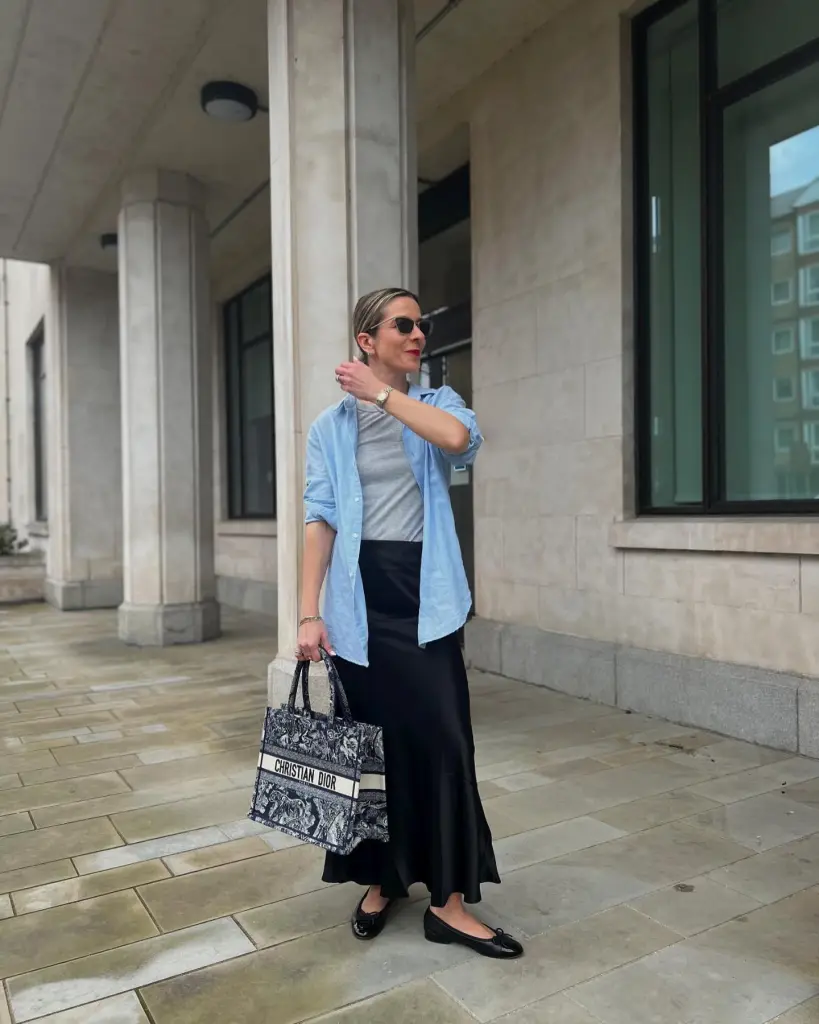 Black Maxi Skirt Outfit Ideas for a Stylish Look 9 Blue Button Down Top, Gray Shirt, and Black Satin Skirt