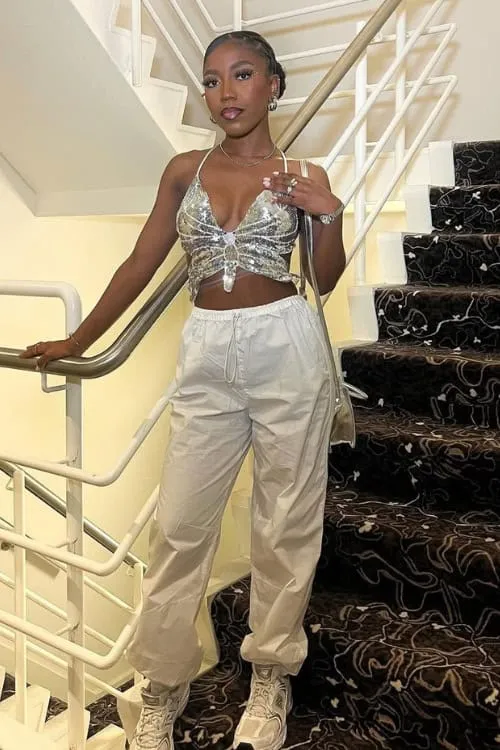 Concert Outfit Ideas to Elevate Your Style 7 Sparkly Bralette and Parachute Pants